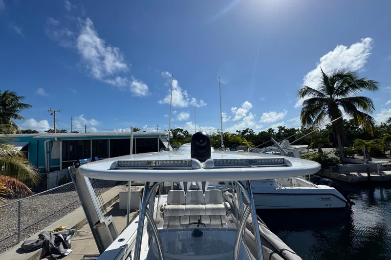 Yacht Photos Pics 2024 Valhalla Boatworks V-29 Hybrid docked under clear blue sky.