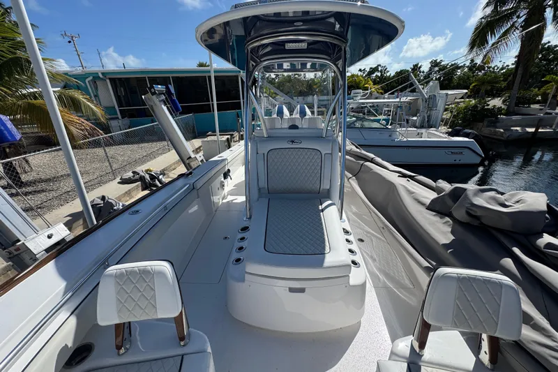  Yacht Photos Pics 2024 Valhalla Boatworks V-29 Hybrid, sleek design, luxurious seating, docked under clear blue sky.