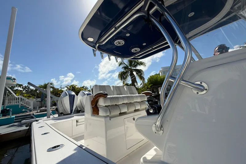  Yacht Photos Pics 2024 Valhalla V-29 Hybrid boat interior with seating and controls, docked under clear sky.
