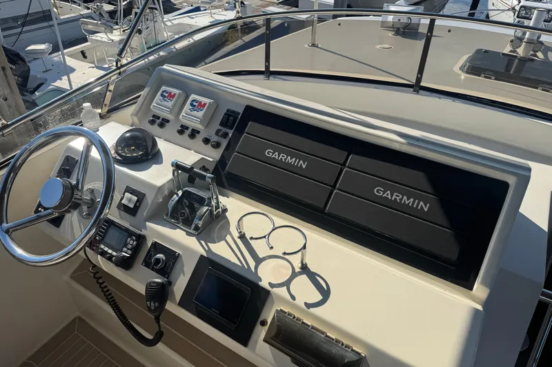 Baby Girl Yacht Photos Pics 1999 McKinna 57 Pilothouse helm with Garmin navigation and control systems.