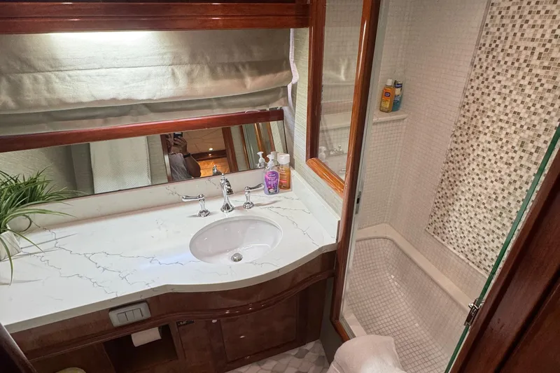 Baby Girl Yacht Photos Pics Luxurious bathroom in 1999 McKinna 57 Pilothouse yacht with marble countertop and modern fixtures.