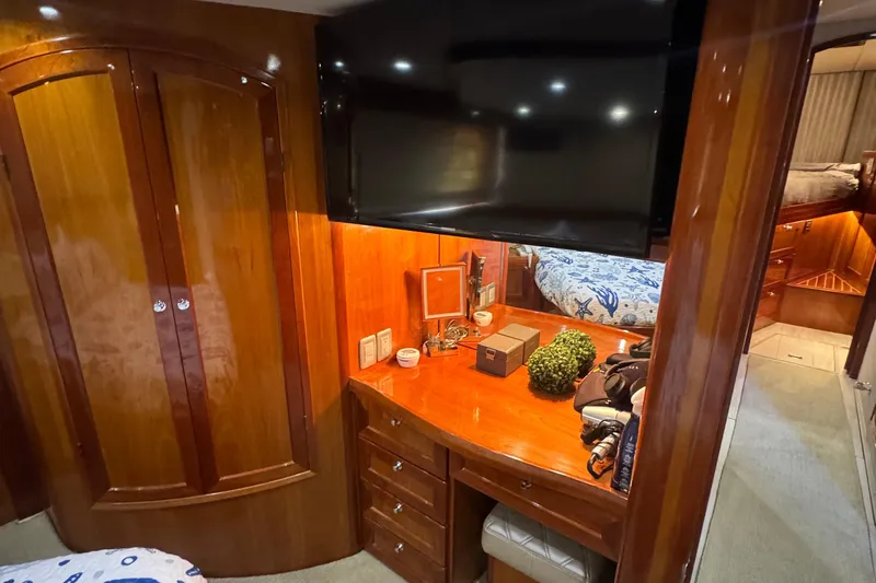 Baby Girl Yacht Photos Pics Luxurious 1999 McKinna 57 Pilothouse interior with wooden cabinetry and modern amenities.