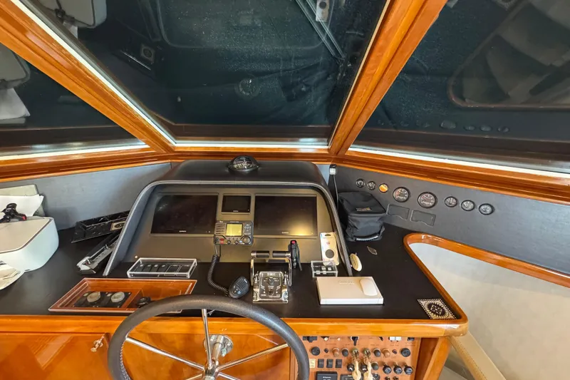 Baby Girl Yacht Photos Pics 1999 McKinna 57 Pilothouse helm with navigation instruments and steering wheel.