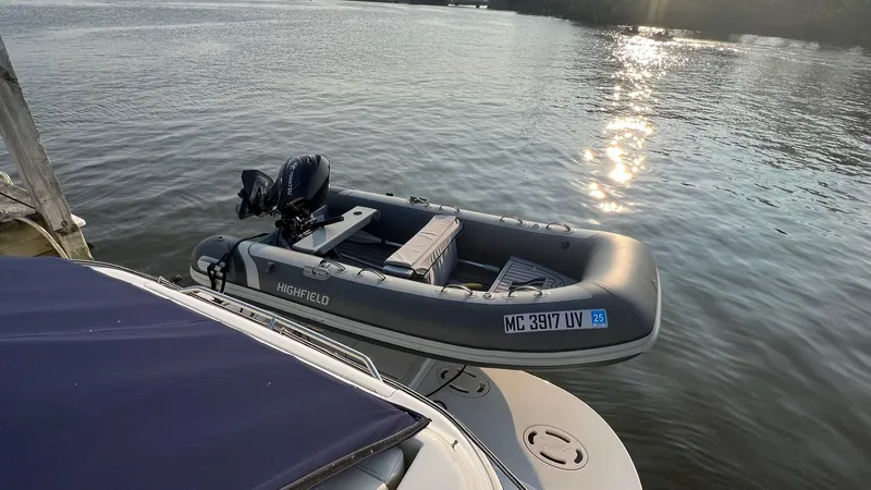 Limin Yacht Photos Pics Inflatable boat moored beside a 2000 Sea Ray 460 Sundancer on a sunny day.