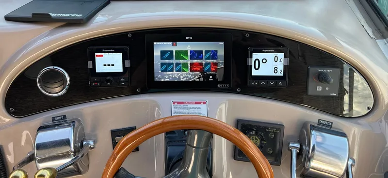Limin Yacht Photos Pics Control panel of a 2000 Sea Ray 460 Sundancer yacht with modern navigation equipment.