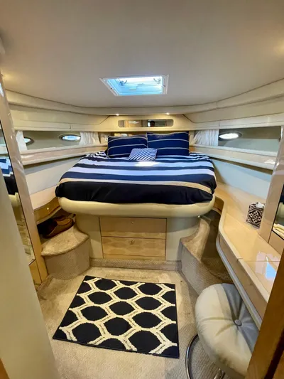 Limin Yacht Photos Pics Luxurious cabin interior of 2000 Sea Ray 460 Sundancer yacht with striped bedding.