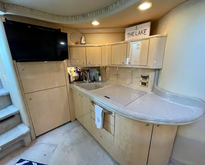 Limin Yacht Photos Pics Luxurious kitchen area in a 2000 Sea Ray 460 Sundancer yacht with modern amenities.