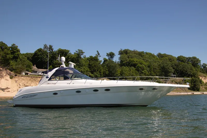 Limin Yacht Photos Pics 2000 Sea Ray 460 Sundancer yacht anchored near a scenic shoreline.