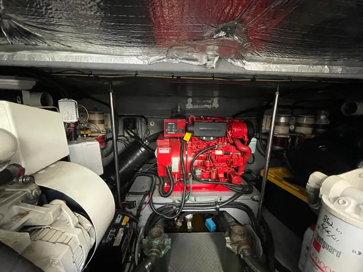 Limin Yacht Photos Pics Engine room of 2000 Sea Ray 460 Sundancer with red engine and equipment.