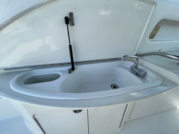 Limin Yacht Photos Pics Kitchen sink area on a 2000 Sea Ray 460 Sundancer yacht.
