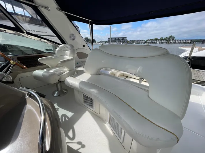 Limin Yacht Photos Pics Luxurious interior of 2000 Sea Ray 460 Sundancer yacht with white seating and helm.