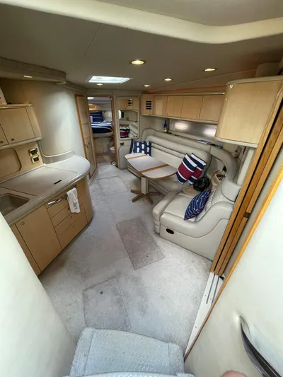 Limin Yacht Photos Pics Interior of 2000 Sea Ray 460 Sundancer yacht with cozy seating and nautical decor.