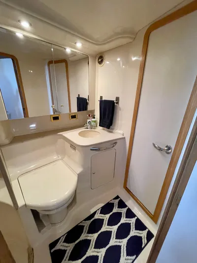 Limin Yacht Photos Pics Luxurious bathroom in 2000 Sea Ray 460 Sundancer yacht with modern fixtures and elegant design.