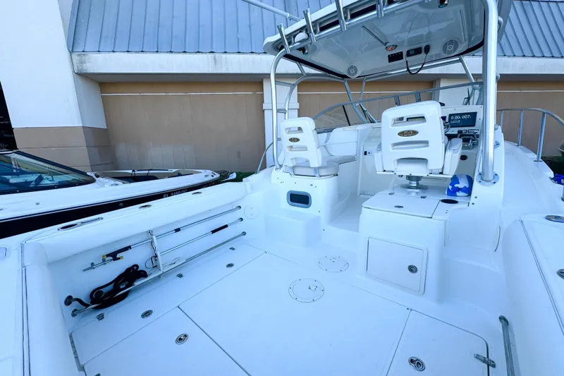 Turn Key Yacht Photos Pics 2006 Boston Whaler 285 Conquest boat interior with seating and fishing equipment.