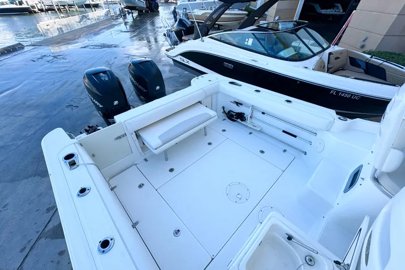 Turn Key Yacht Photos Pics 2006 Boston Whaler 285 Conquest boat with spacious deck and dual Mercury engines.