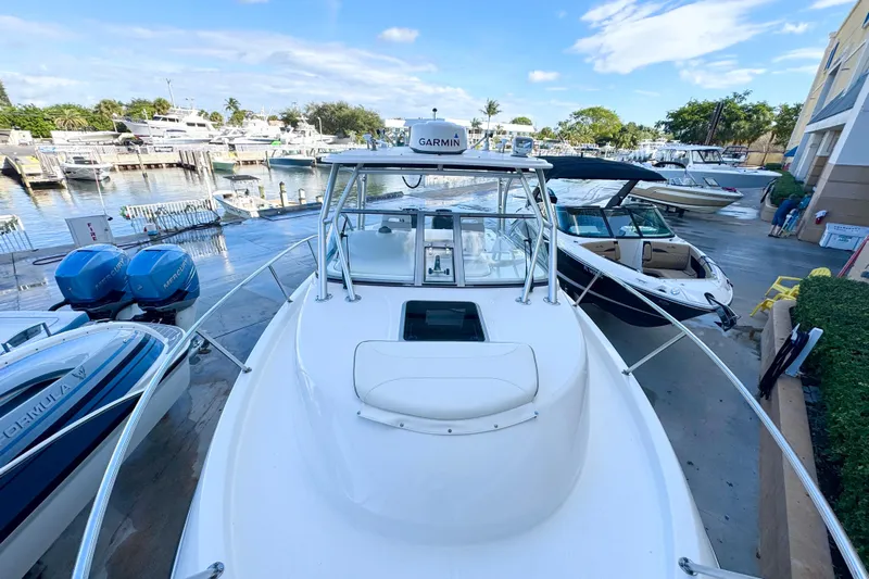 Turn Key Yacht Photos Pics 2006 Boston Whaler 285 Conquest boat docked at marina with clear sky.