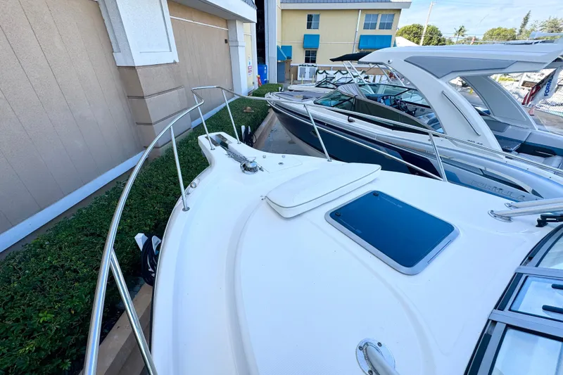 Turn Key Yacht Photos Pics 2006 Boston Whaler 285 Conquest boat docked, showcasing sleek design and spacious deck.