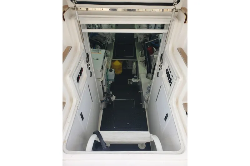 Salty Soul Yacht Photos Pics 2023 Viking 48 Sport Tower engine room with equipment and controls.