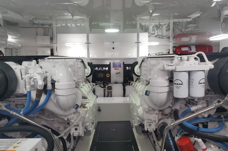 Salty Soul Yacht Photos Pics Engine room of 2023 Viking 48 Sport Tower yacht, featuring MAN engines and equipment.
