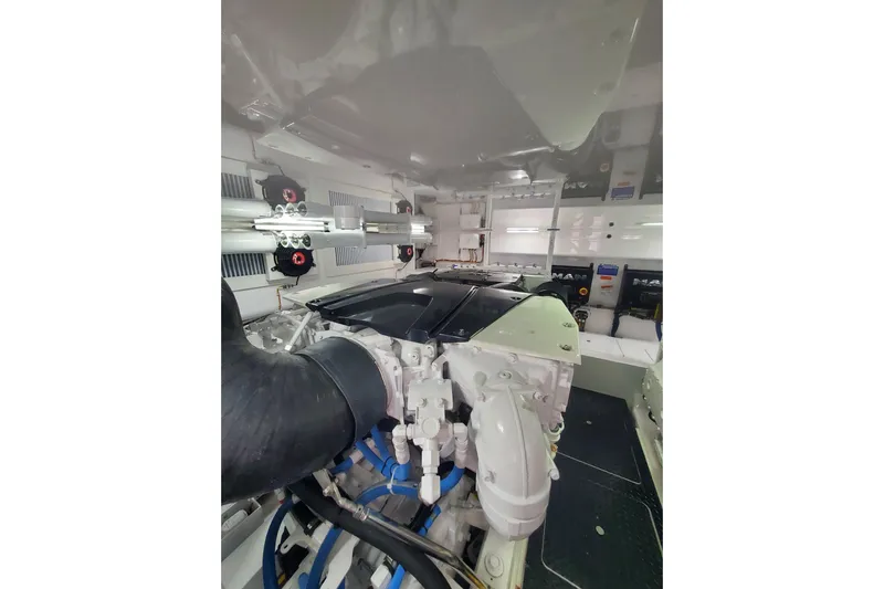 Salty Soul Yacht Photos Pics Engine room of 2023 Viking 48 Sport Tower yacht, showcasing advanced machinery.