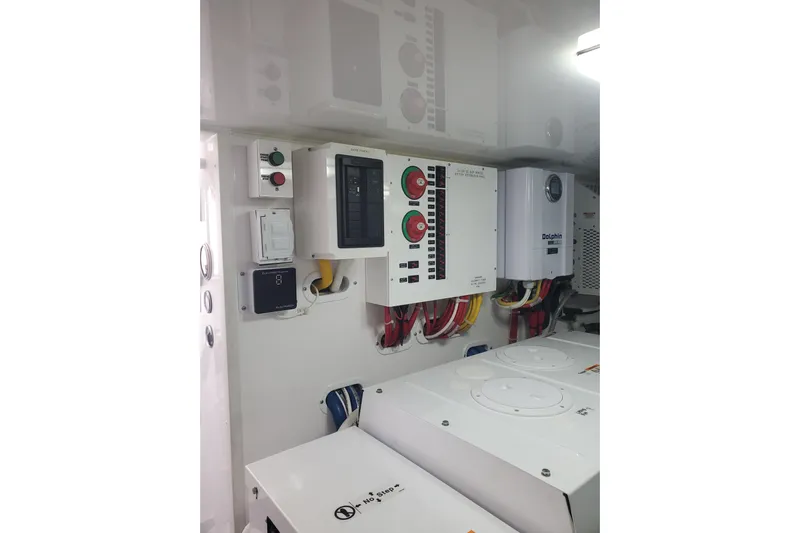 Salty Soul Yacht Photos Pics Electrical panel in 2023 Viking 48 Sport Tower engine room, featuring control systems and wiring.