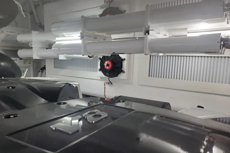 Salty Soul Yacht Photos Pics Engine room of 2023 Viking 48 Sport Tower with visible components and equipment.