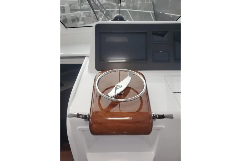 Salty Soul Yacht Photos Pics 2023 Viking 48 Sport Tower helm with polished wood and modern navigation display.