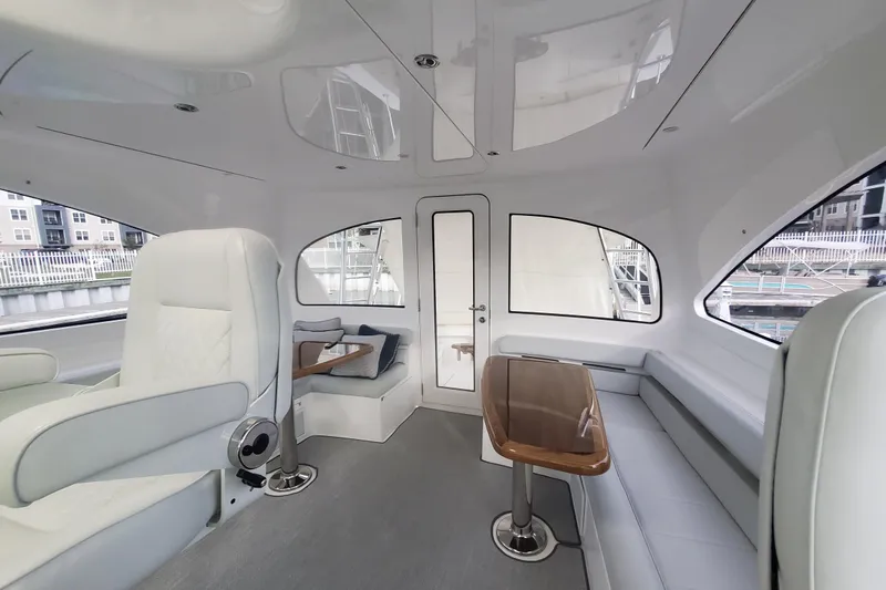 Salty Soul Yacht Photos Pics Luxurious interior of 2023 Viking 48 Sport Tower yacht with elegant seating and modern design.