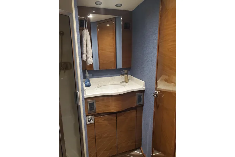 Salty Soul Yacht Photos Pics Luxurious bathroom in 2023 Viking 48 Sport Tower yacht with modern fixtures.