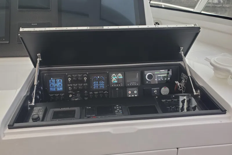 Salty Soul Yacht Photos Pics 2023 Viking 48 Sport Tower control panel with advanced navigation and communication systems.
