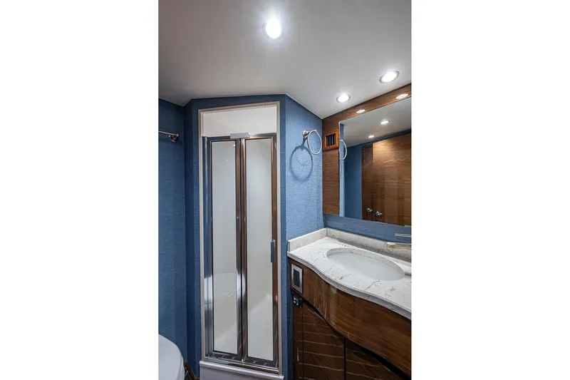 Salty Soul Yacht Photos Pics Luxurious bathroom in 2023 Viking 48 Sport Tower yacht with modern shower and vanity.