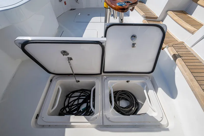 Salty Soul Yacht Photos Pics Open storage compartments on 2023 Viking 48 Sport Tower boat deck.