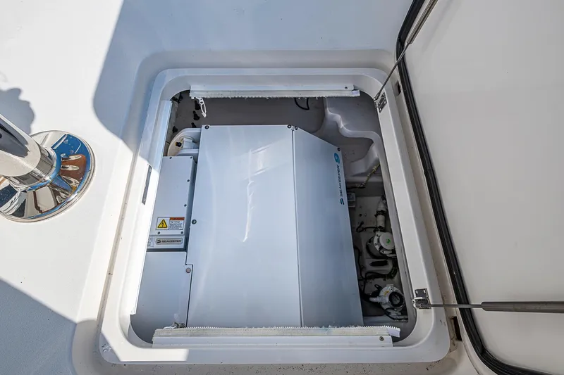 Salty Soul Yacht Photos Pics 2023 Viking 48 Sport Tower engine compartment with visible machinery and components.