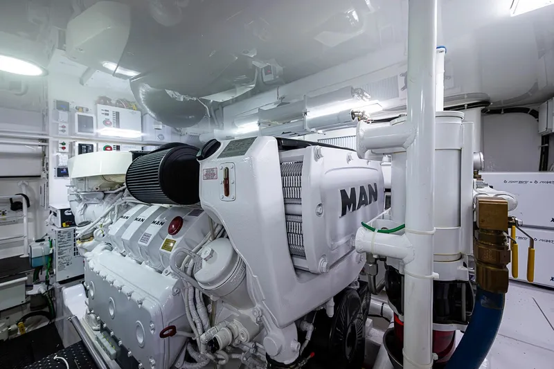 Salty Soul Yacht Photos Pics Engine room of 2023 Viking 48 Sport Tower with MAN engine components.