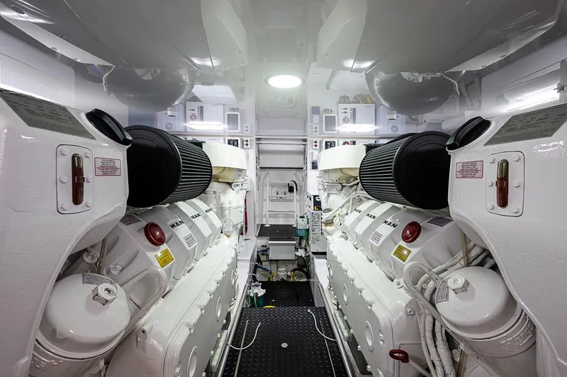 Salty Soul Yacht Photos Pics Engine room of 2023 Viking 48 Sport Tower, featuring dual engines and modern equipment.