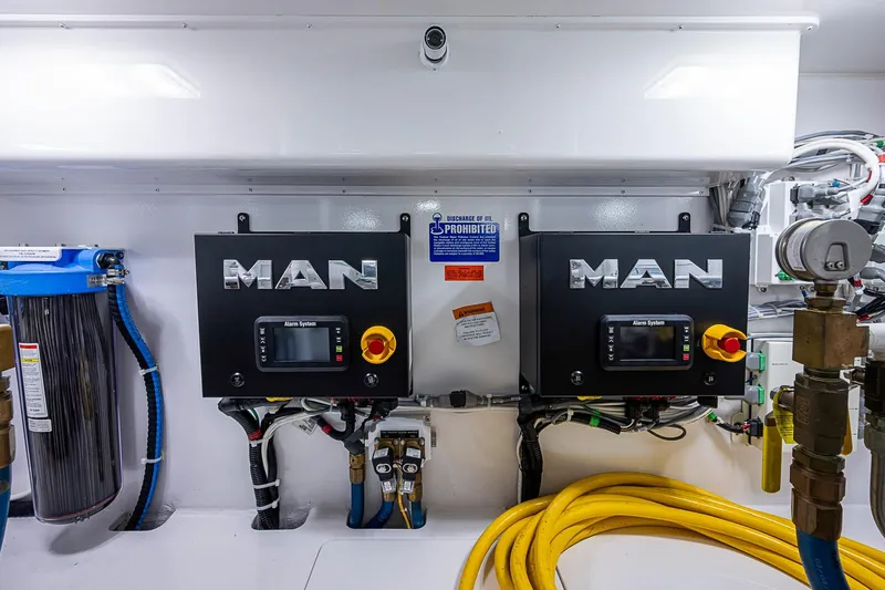 Salty Soul Yacht Photos Pics Engine room of 2023 Viking 48 Sport Tower with MAN control systems and equipment.