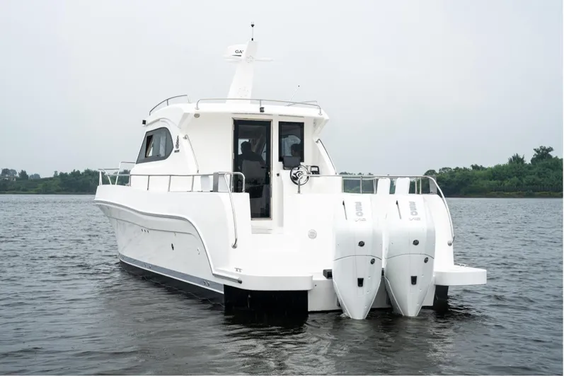 Commander Yacht Photos Pics 2024 Bracewell 36SF Commander boat on water, rear view with twin engines.