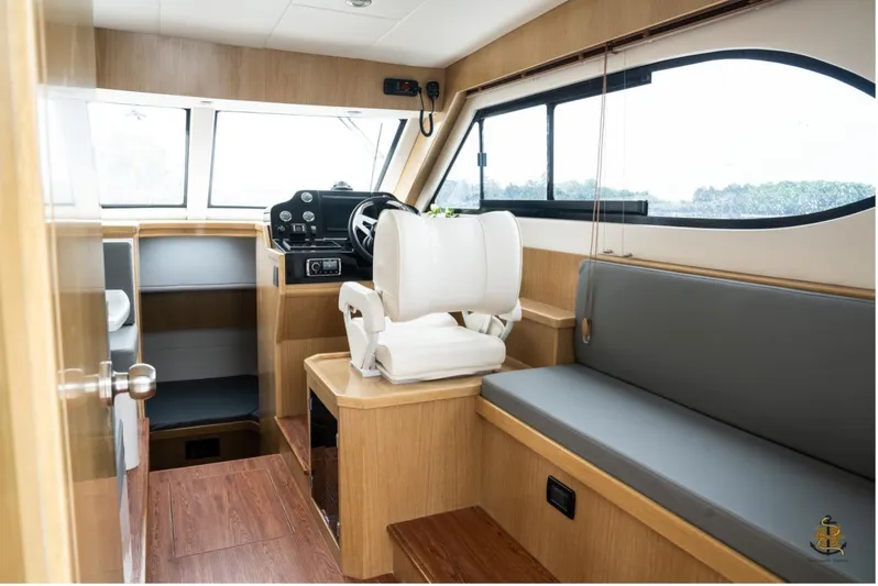 Commander Yacht Photos Pics Interior of 2024 Bracewell 36SF Commander boat with helm and seating area.