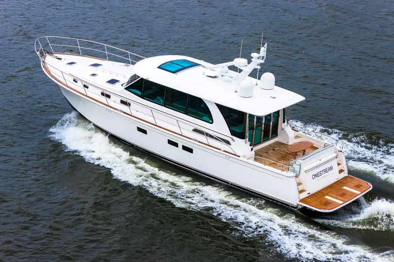  Yacht Photos Pics 2024 Sabre 58 Salon Express yacht cruising on open water.