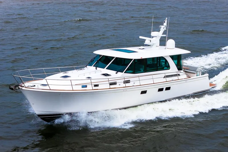  Yacht Photos Pics 2024 Sabre 58 Salon Express yacht cruising on open water.