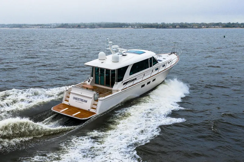  Yacht Photos Pics 2024 Sabre 58 Salon Express yacht cruising on open water.