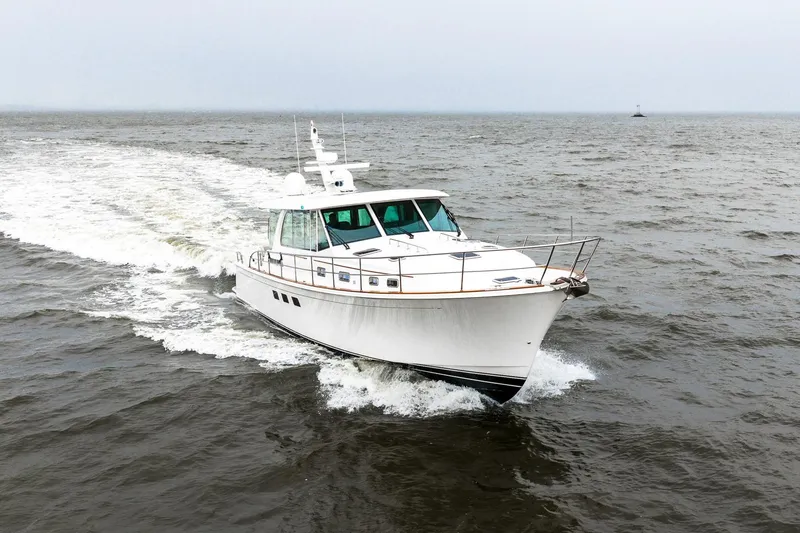  Yacht Photos Pics 2024 Sabre 58 Salon Express yacht cruising on open water.