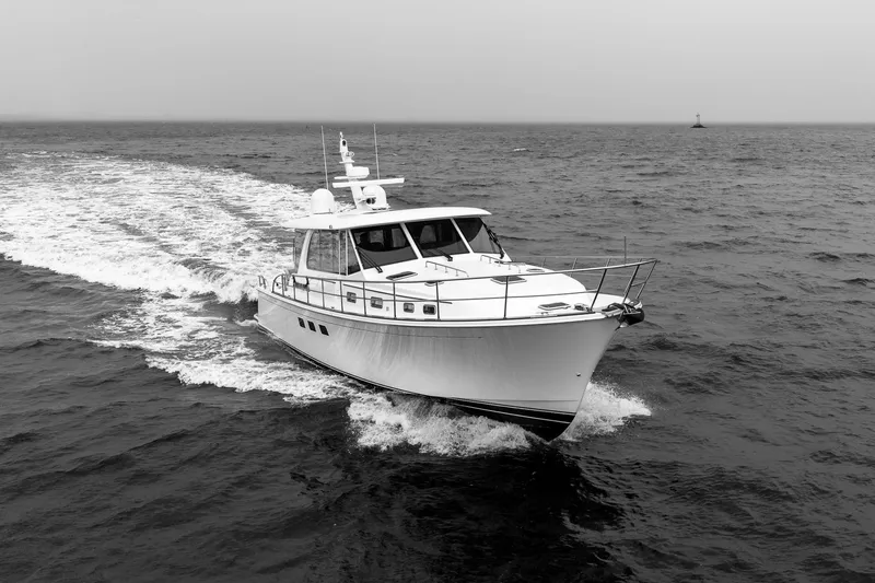  Yacht Photos Pics 2024 Sabre 58 Salon Express yacht cruising on open water, black and white image.