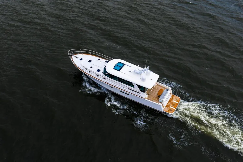  Yacht Photos Pics Aerial view of 2024 Sabre 58 Salon Express yacht cruising on open water.