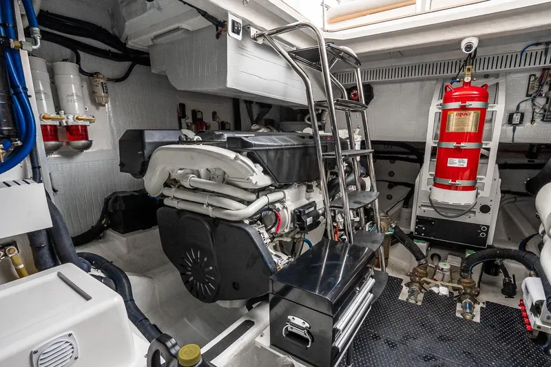  Yacht Photos Pics Engine room of 2024 Sabre 58 Salon Express yacht with fire extinguisher and machinery.