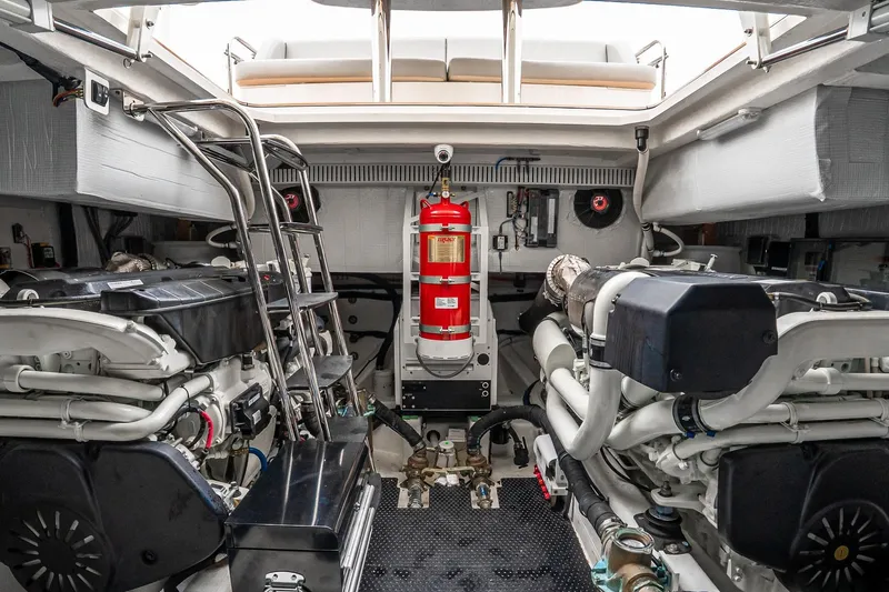  Yacht Photos Pics Engine room of 2024 Sabre 58 Salon Express, featuring dual engines and fire extinguisher.