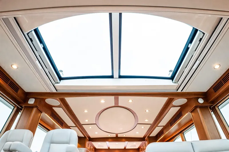  Yacht Photos Pics 2024 Sabre 58 Salon Express interior with skylight and elegant wood finish.