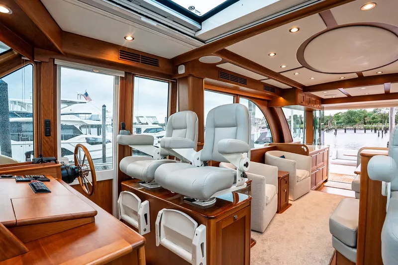  Yacht Photos Pics Luxurious interior of 2024 Sabre 58 Salon Express yacht with plush seating and elegant wood finishes.