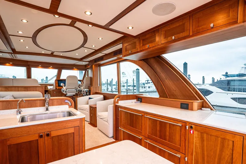  Yacht Photos Pics Luxurious interior of 2024 Sabre 58 Salon Express yacht with elegant wood finishes.