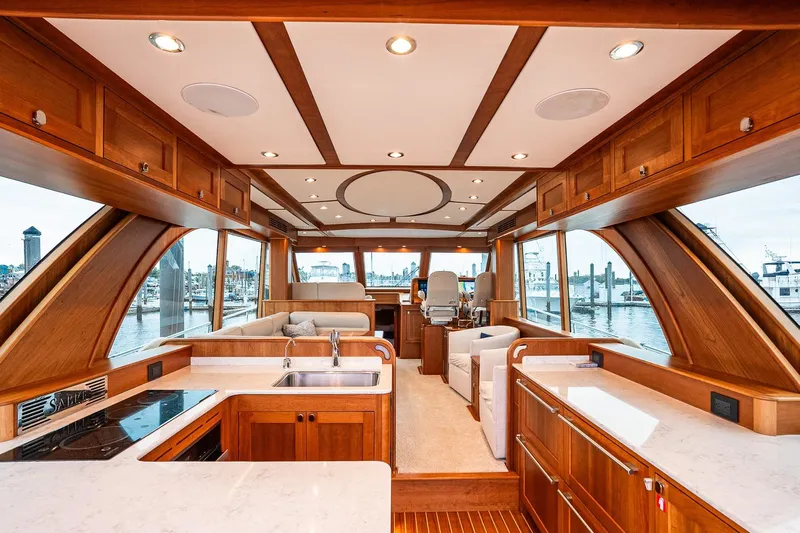  Yacht Photos Pics Luxurious interior of 2024 Sabre 58 Salon Express yacht with elegant wood finishes.
